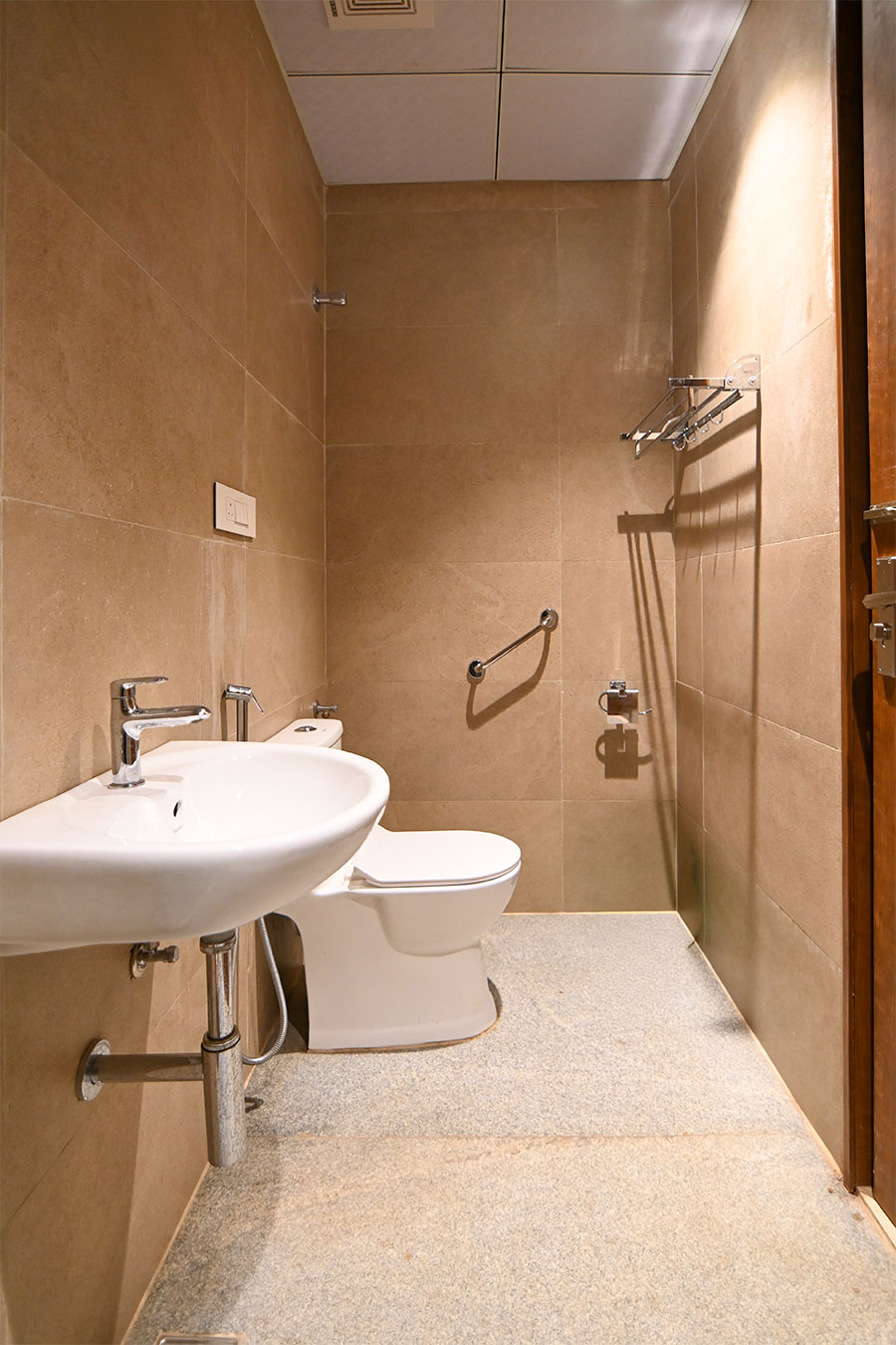 Clean modern restrooms with marble tiles