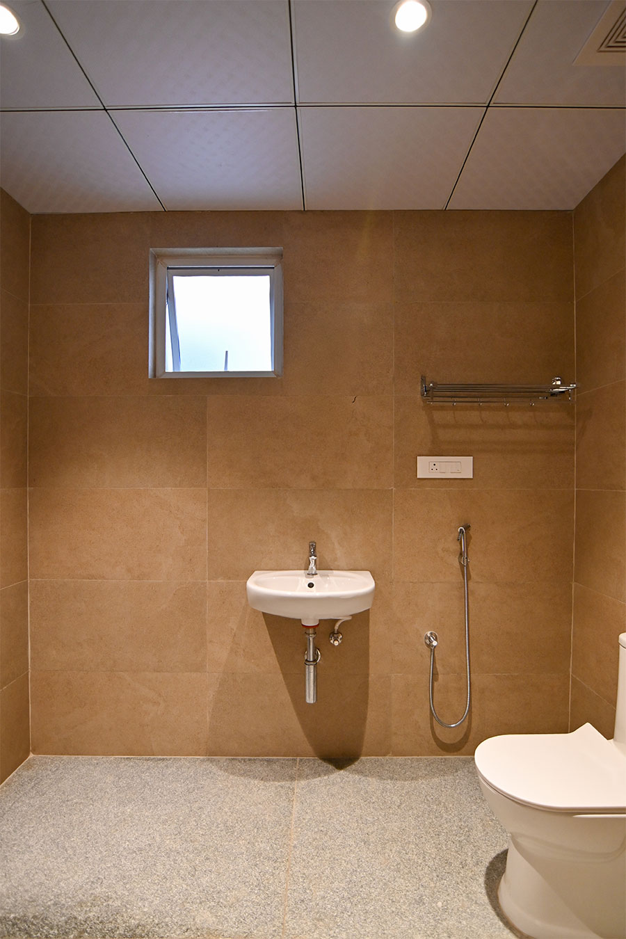 Clean modern restrooms with marble tiles