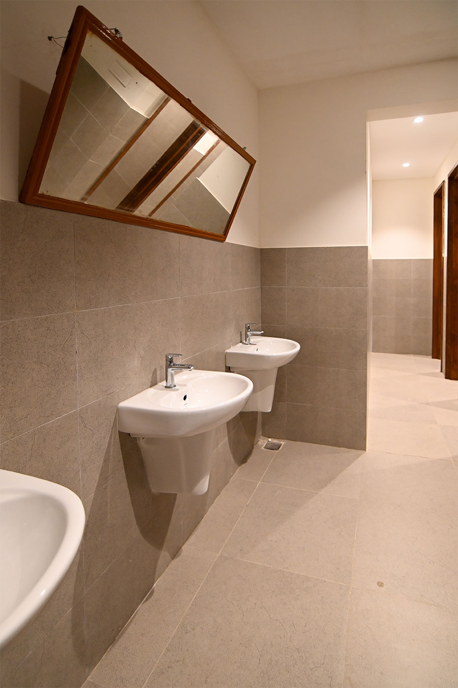 Clean modern restrooms with marble tiles