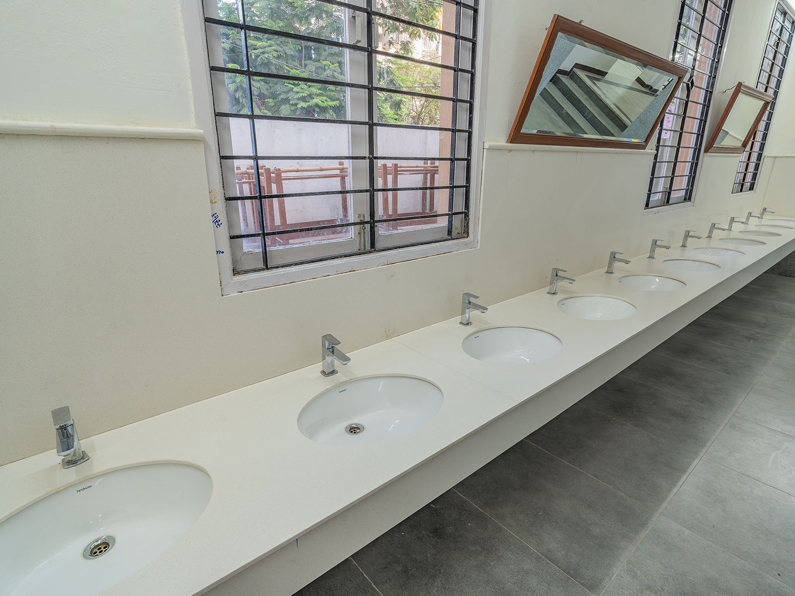 Clean modern WashArea with marble tiles